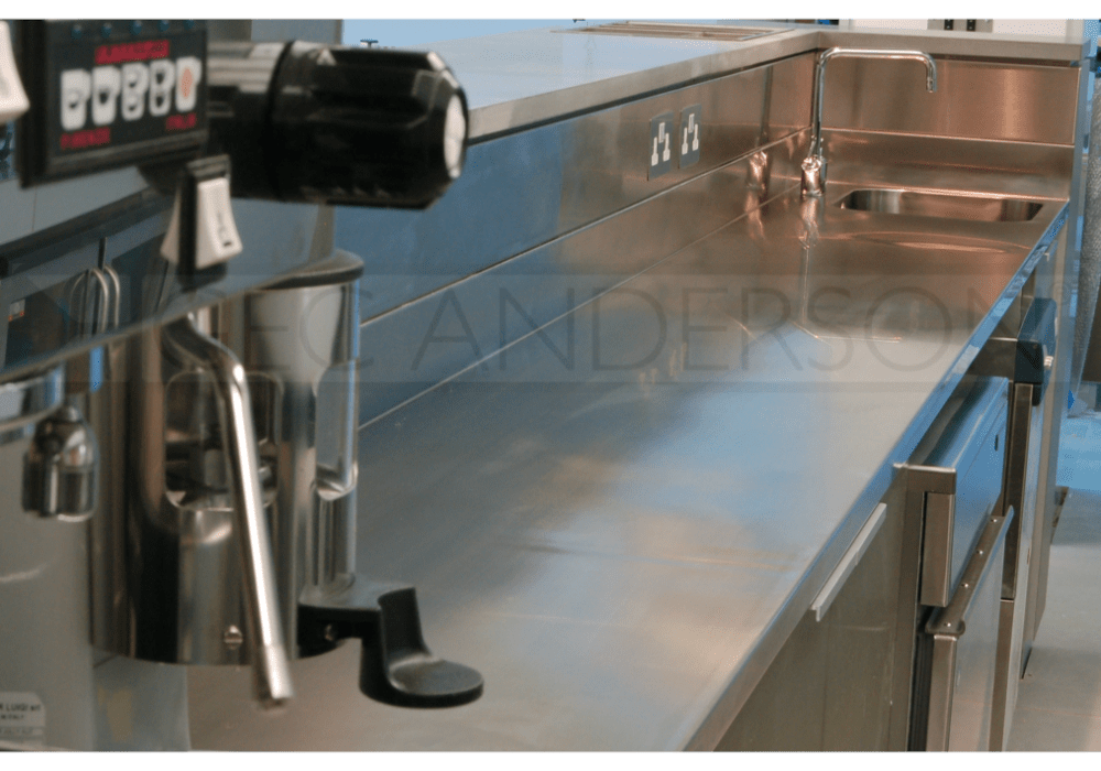 Stainless steel counter with integral sink and upstands