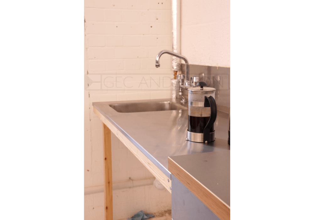 Tea point worktop with integral sink and splashback