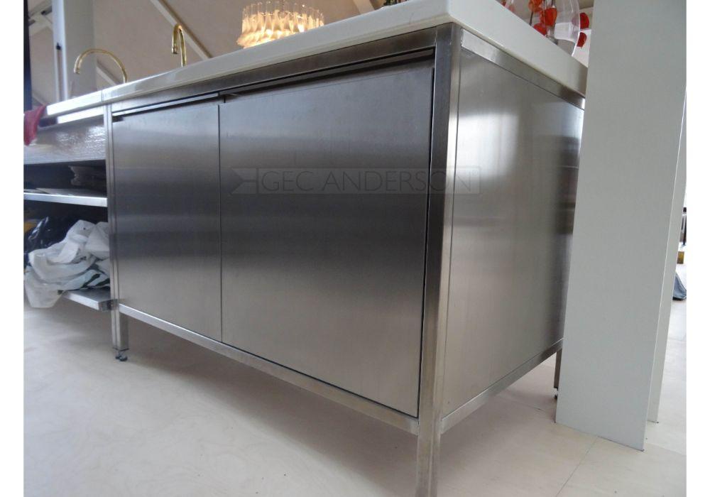 Stainless steel base cabinets with recessed handles. Lava stone sinktop.