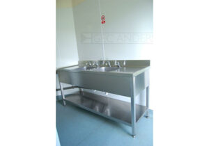 Freestanding Decimetric® sinktop with legs and undershelf.