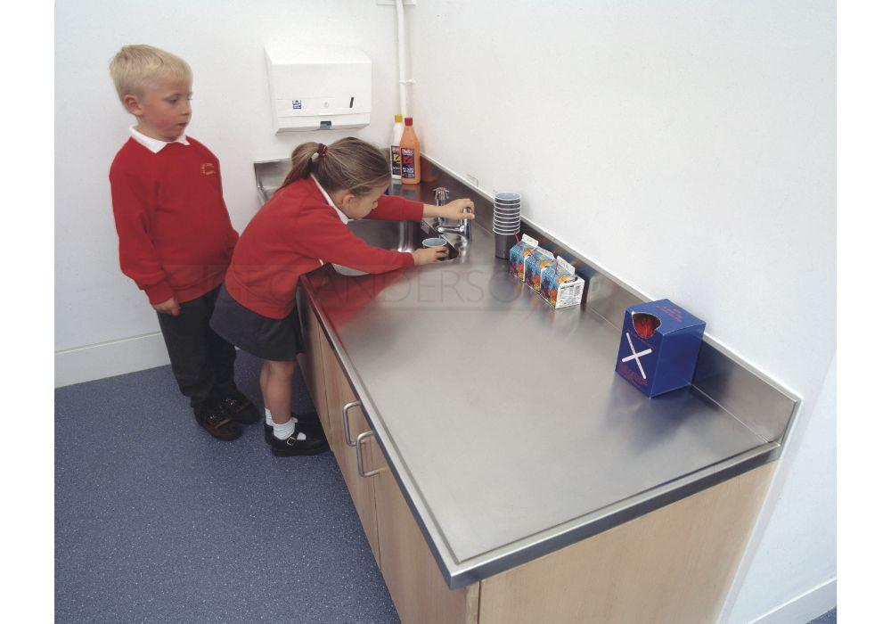 Neat and practical worktops with lipped edge (3) to exposed edges and integral upstands (edge 10) to wall junctions.