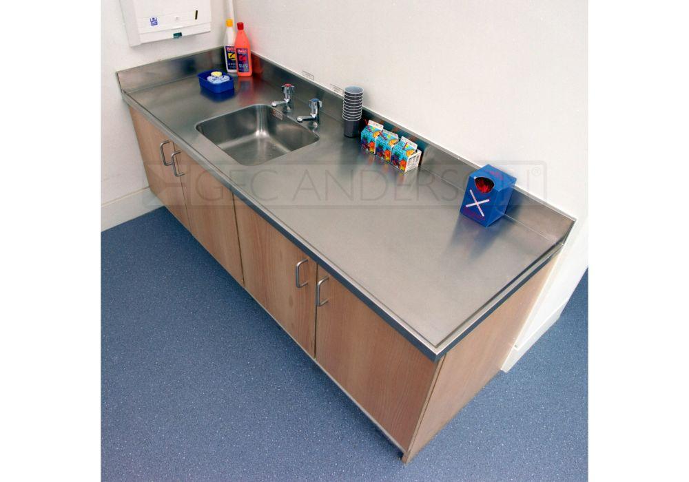 Neat and practical worktops with lipped edge (3) to exposed edges and integral upstands (edge 10) to wall junctions.